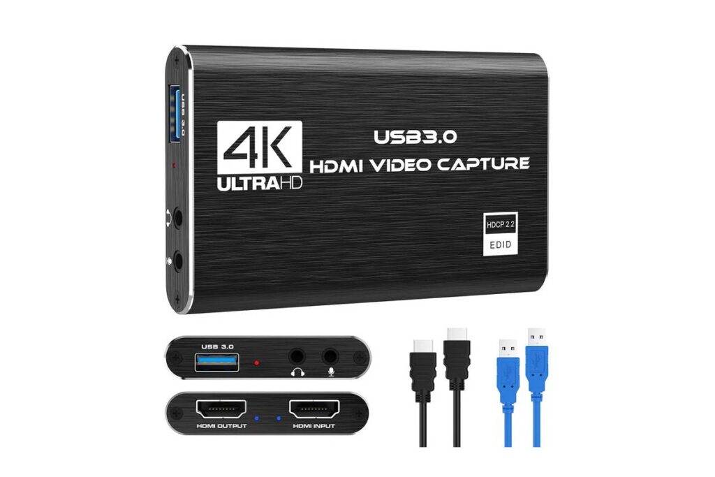 A sleek black HDMI video capture device supporting 4K Ultra HD, with USB 3.0 and HDMI input/output ports. Includes two cables.