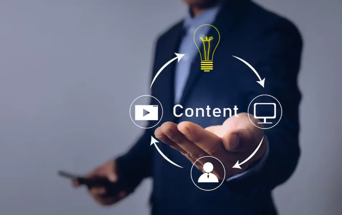 A businessman presents a graphical concept of content creation, featuring a light bulb and icons for video, computer, and user interaction.