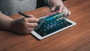 Person using a stylus on a tablet displaying a futuristic digital calendar